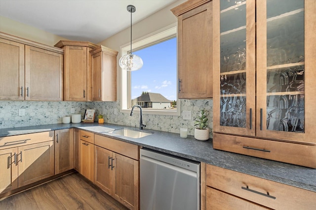 kitchen with tasteful backsplash, sink, pendant lighting, stainless steel dishwasher, and dark hardwood / wood-style floors