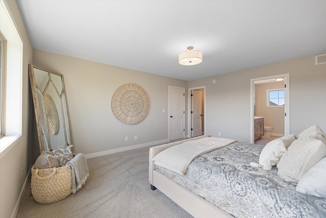 carpeted bedroom with ensuite bathroom