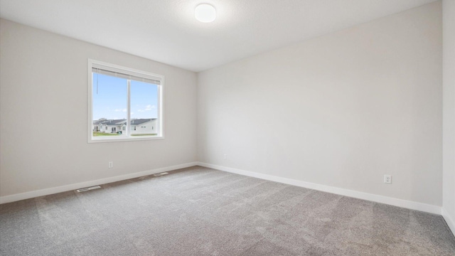 spare room featuring carpet floors