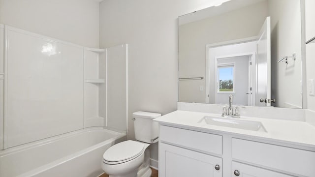 full bathroom featuring toilet, vanity, and  shower combination