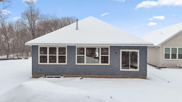 view of snow covered house