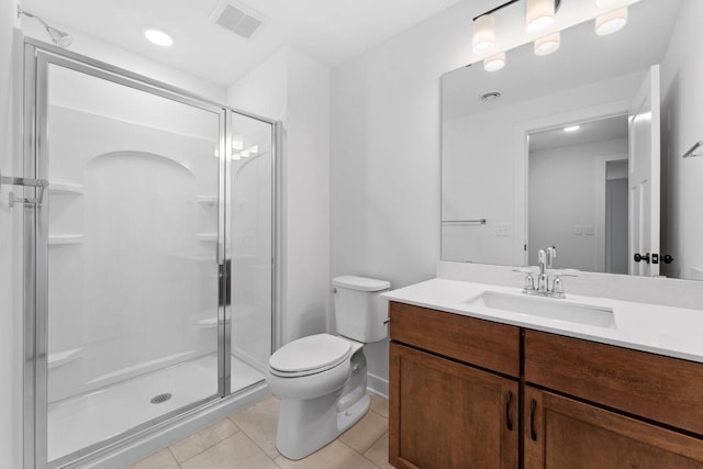 bathroom with walk in shower, vanity, toilet, and tile patterned flooring