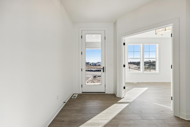 hallway featuring hardwood / wood-style flooring