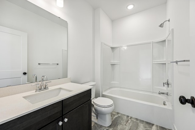 full bathroom with vanity, bathtub / shower combination, and toilet