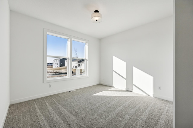 unfurnished room featuring carpet flooring