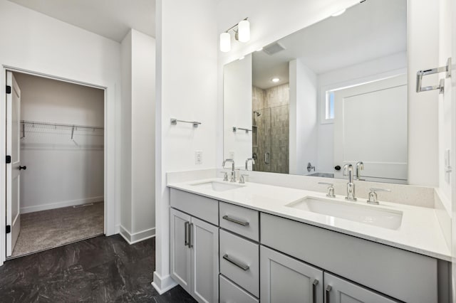 bathroom with vanity and an enclosed shower