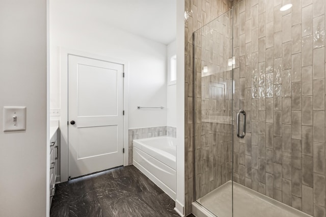 bathroom featuring vanity and separate shower and tub