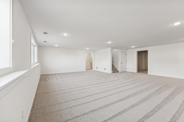 interior space featuring light carpet