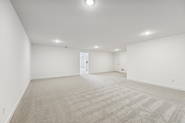 spare room with light carpet