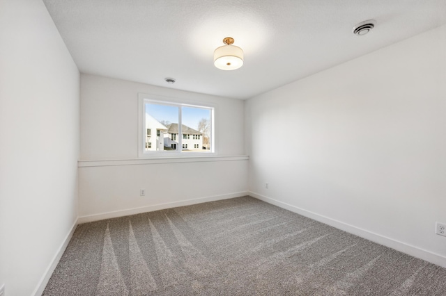 empty room featuring carpet flooring