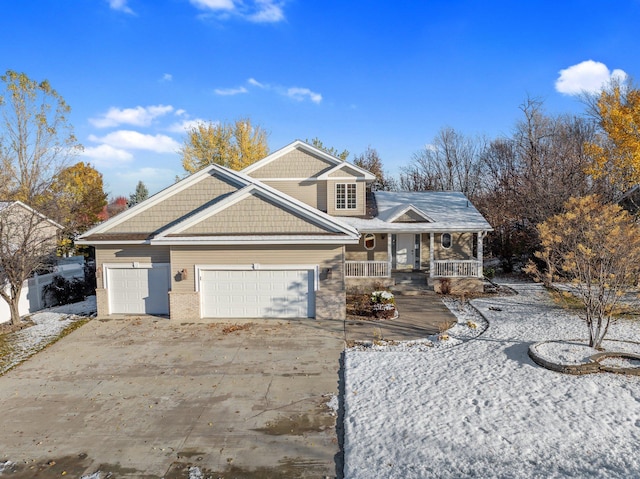 view of front of property featuring a porch and a garage