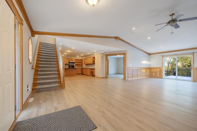 unfurnished living room with light hardwood / wood-style flooring, ceiling fan, and crown molding