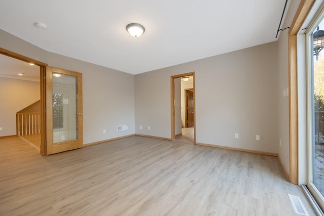 spare room featuring light hardwood / wood-style floors