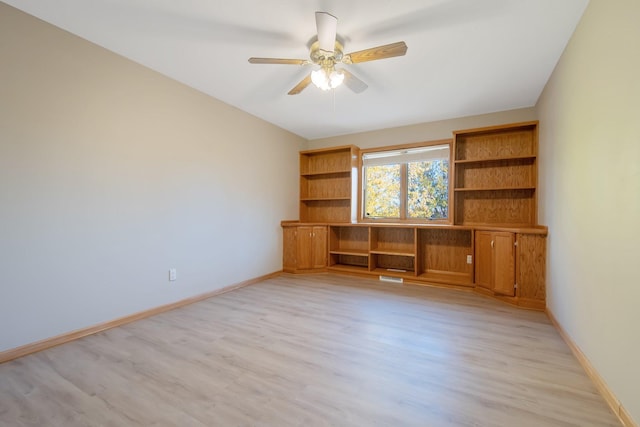 interior space with light hardwood / wood-style floors and ceiling fan