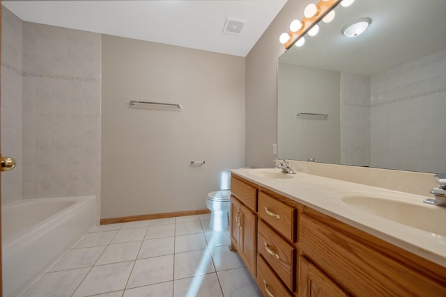 bathroom featuring vanity, toilet, and tile patterned floors