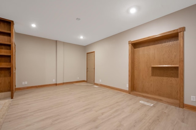 unfurnished bedroom with light wood-type flooring