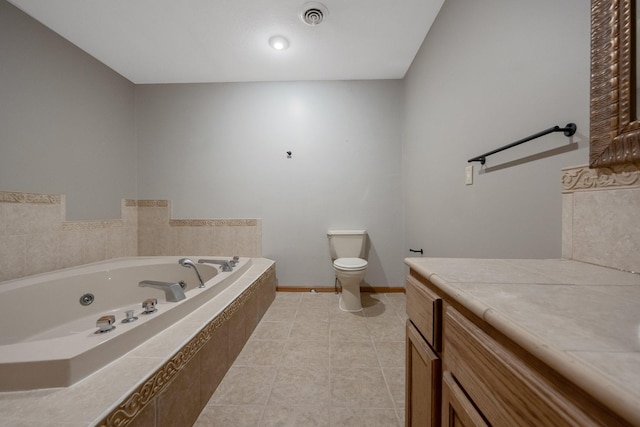 bathroom with toilet, vanity, tile patterned floors, and tiled bath