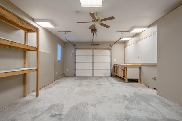 garage with a garage door opener and ceiling fan