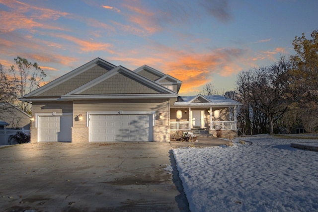 craftsman-style home with a garage and a porch