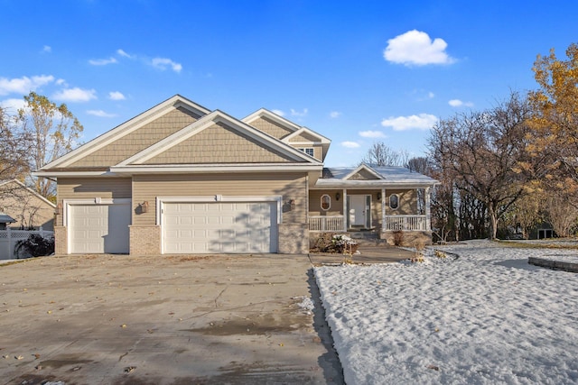 view of front of house featuring covered porch and a garage