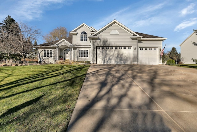 view of front of home featuring a garage and a front lawn