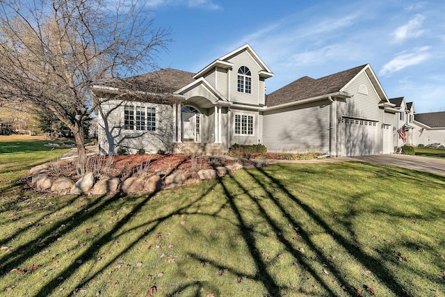 view of front of property featuring a garage and a front yard