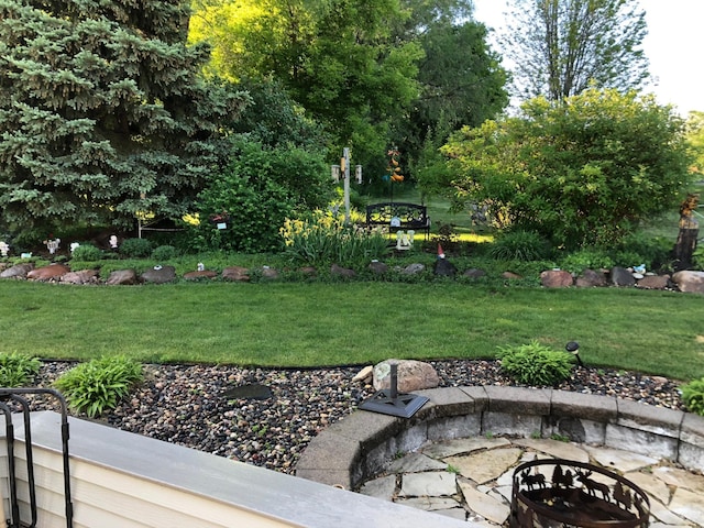 view of yard with an outdoor fire pit