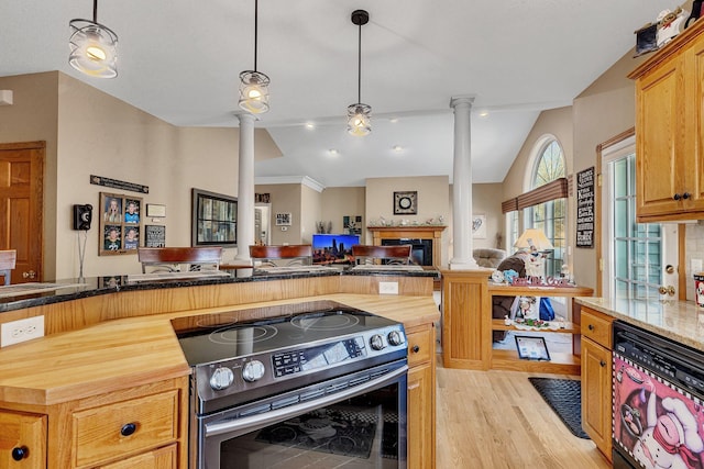 kitchen with decorative columns, stainless steel range with electric stovetop, vaulted ceiling, light hardwood / wood-style floors, and hanging light fixtures