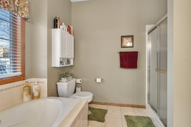 bathroom with toilet, tile patterned floors, and plus walk in shower