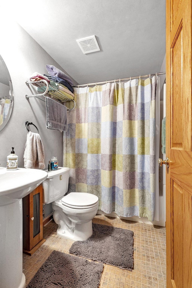 bathroom featuring toilet