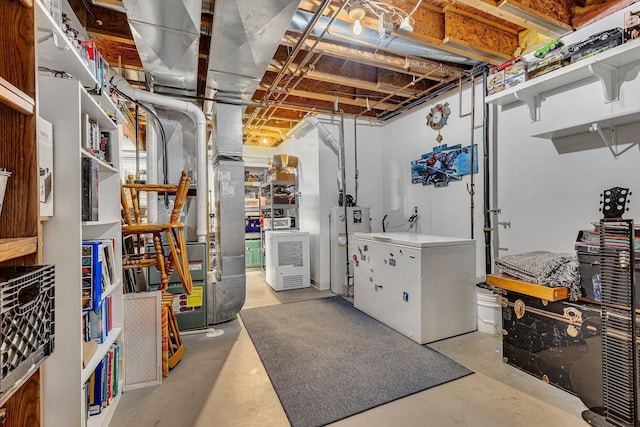 basement featuring refrigerator and water heater