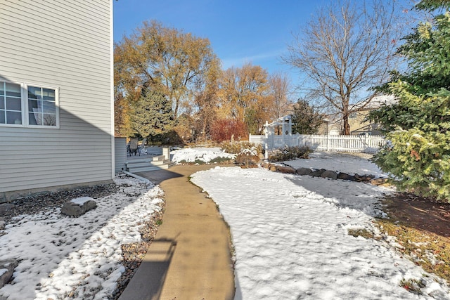 view of yard covered in snow