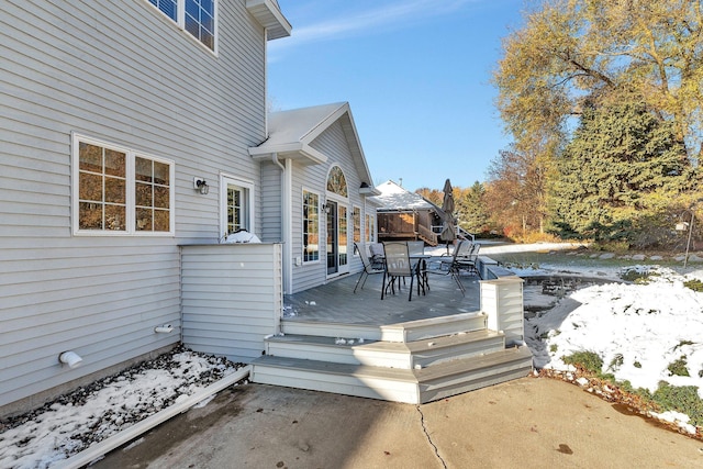 view of snow covered deck