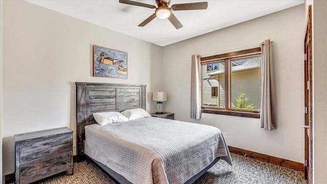 bedroom with baseboards and a ceiling fan