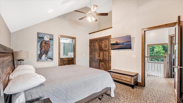 carpeted bedroom with ensuite bathroom, high vaulted ceiling, a ceiling fan, baseboards, and access to exterior