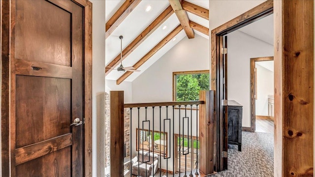 corridor with lofted ceiling with beams