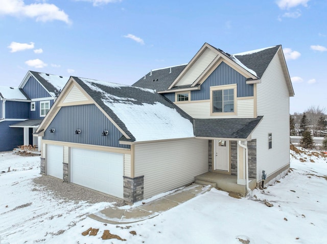 view of front of house with stone siding, board and batten siding, and roof with shingles