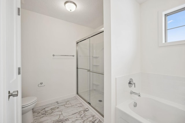 bathroom featuring a garden tub, marble finish floor, a stall shower, a textured ceiling, and baseboards