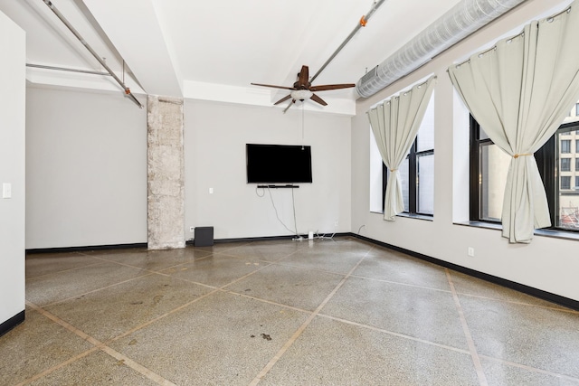 unfurnished living room featuring ceiling fan