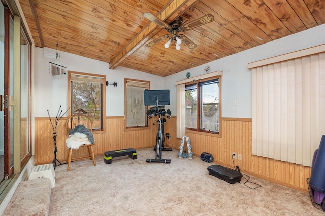 exercise area featuring wood walls, carpet flooring, wood ceiling, ceiling fan, and vaulted ceiling