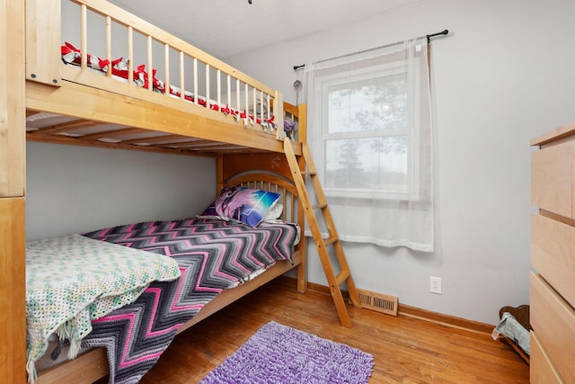 bedroom featuring hardwood / wood-style flooring