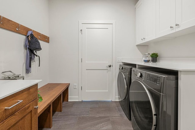 laundry area featuring cabinets and independent washer and dryer