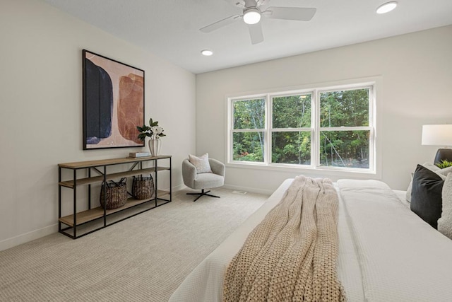 bedroom featuring ceiling fan and light colored carpet