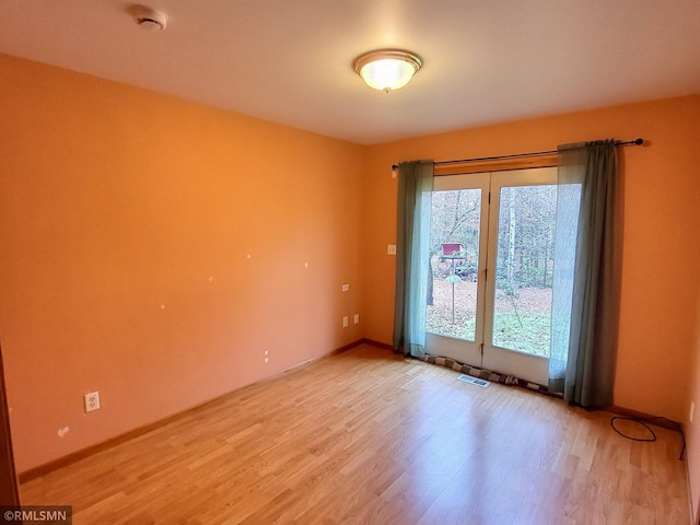 empty room with hardwood / wood-style floors