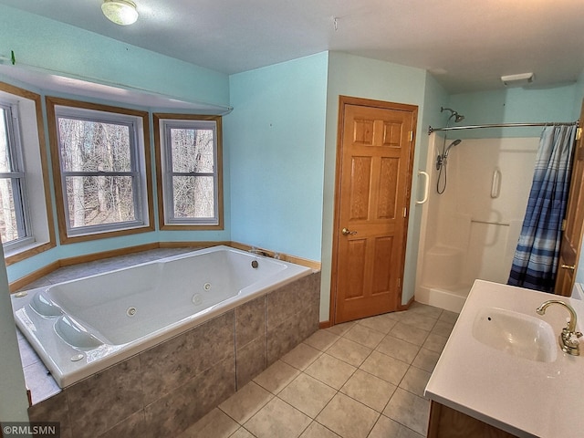 bathroom with tile patterned floors, vanity, and separate shower and tub