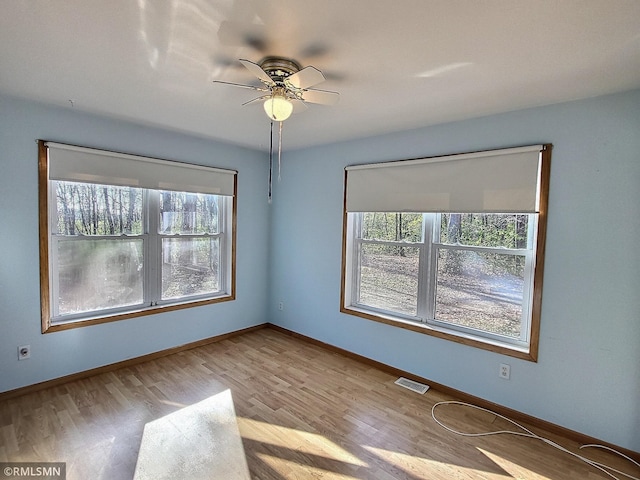 unfurnished room featuring ceiling fan and light hardwood / wood-style flooring