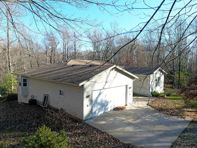 view of side of property featuring a garage