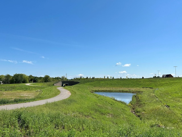 view of property's community with a rural view and a water view