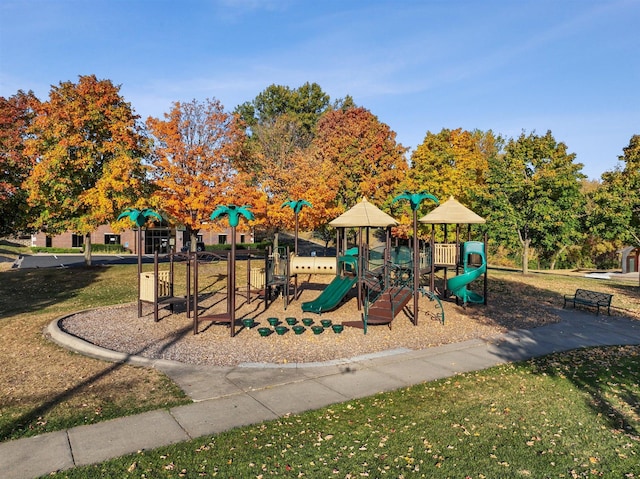 view of jungle gym featuring a lawn