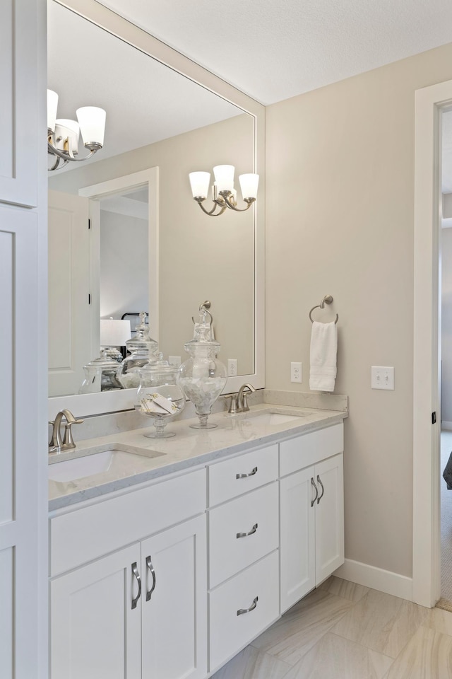 bathroom with vanity and a textured ceiling